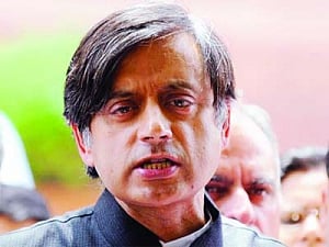 Stop praising Modi, Kerala's Cong warns Tharoor