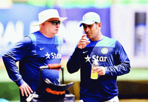 Dhoni defends bowlers