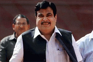 Gadkari courts controversy by riding scooter without helmet