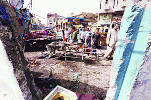 21 dead after twin blasts rock Baghdad