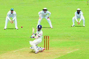 Rahul, Ojha fifties stabilise Board XI