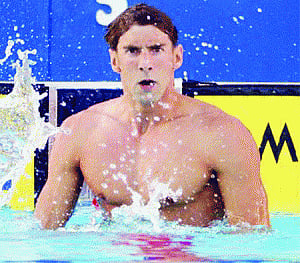 Phelps swims to glory line