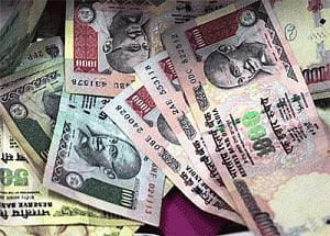 Rupee drops 2 paise against USD in late morning trade