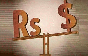 Rupee down by 17 paise vs dollar in late morning trade