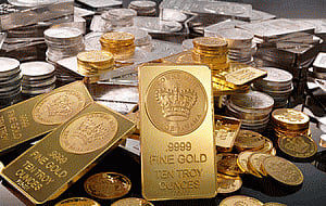 Gold, silver drop on reduced demand, global cues