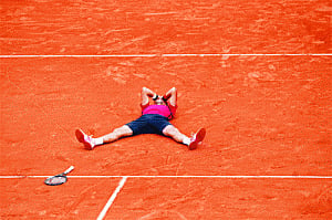 Wins French Open beating Murray 3-6, 6-1, 6-2, 6-4; Completes non-calendar Grand Slam