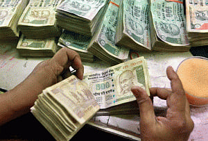Rupee reacts downwards by 6 paise to 67.21
