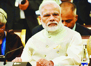 PM ticks off FM's critics, praises Rajan