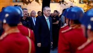 Erdogan shuts schools, charities in first state of emergency decree