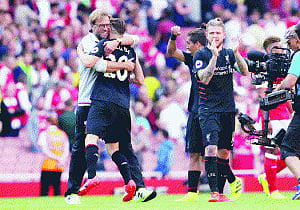Reds cruise, Blues squeeze through