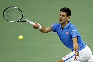 Djokovic shakes off elbow, beats Edmund