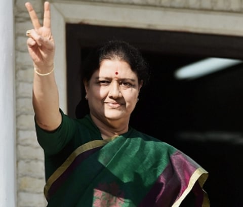 Chinnamma drapes Amma's cap