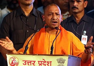 Yogi unveils booklet on achievements; promises development