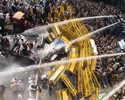 Farmers stopped at Delhi-UP border; police use water cannons, tear gas