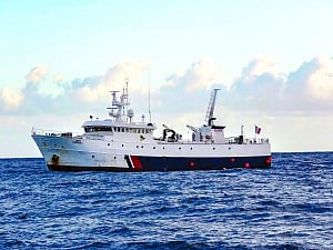 French fishing boat port in storm for hurt Navy officer