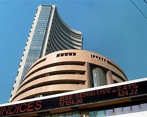 Global cues, rupee dent equity indices; Sensex down over 400 points