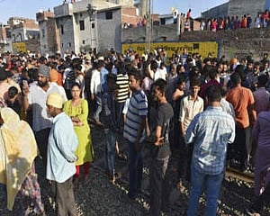 Protestors clash with police near Amritsar accident site after they are removed from tracks