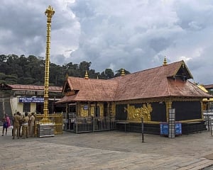 Woman begins climbing Sabarimala hill amid protests