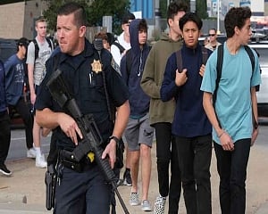 Gunman in US school shooting dies as police hunt motive
