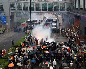 HK police say violent protesters forced use of water cannon, warning shot