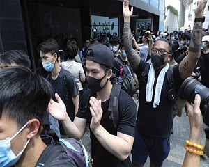 Hong Kong protesters flood city streets in 'peaceful' march