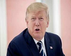 Isolated Trump descends on G7, talking trade war