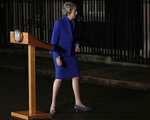 May battles to keep Brexit on track after no-confidence win