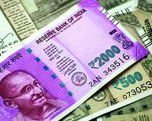 Rupee slips 15 paise to 69.84 vs USD in early trade