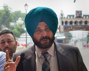 Sidhu, Majithia exchange barbs, SAD burn photos of Sidhu's Pak visit