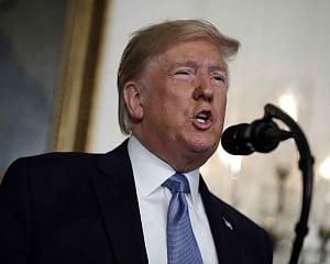 Trump faces hostility on visits to massacre sites