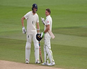 Buttler survives scare to reach century, England 373-4