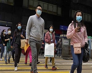 Hong Kong shuts most China crossings over virus as medics strike