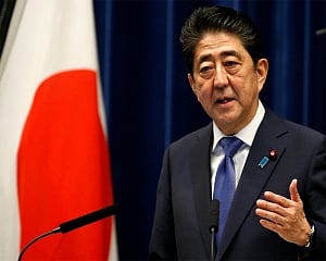 Japan urges head of WHO to help speed vaccines