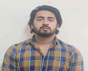 NE Delhi violence: Man who pointed gun at unarmed policeman arrested from UP