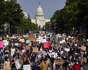 Protests turn subdued after new charges in Floyd case