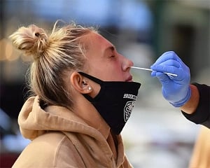 Single-day Covid-19 cases in US top 100,000