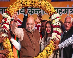 Take dip in Yamuna with your shirt off, Shah dares Kejriwal