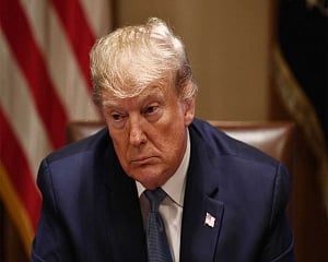 Trump faces credibility test as he plays down virus threat