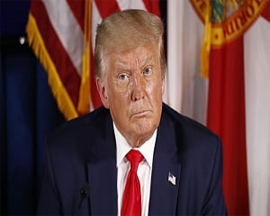 Trump golfs in Florida as COVID relief hangs in the balance