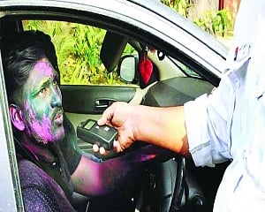 Virus-hit Holi subdued