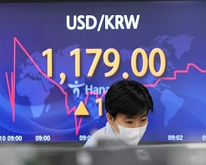 Asian shares mixed after US inflation report