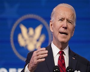 Biden questions 'macho' move to refuse vaccine