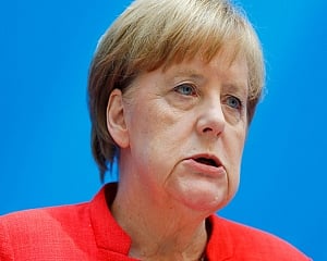 Germany's Merkel points to variant risk as infections drop