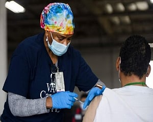 Half of US adults now have received at least 1 COVID shot