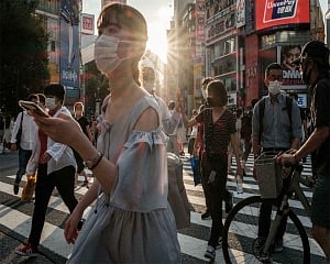 Japan extends, expands coronavirus emergency as cases surge