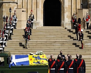 Prince Philip is laid to rest as somber queen sits alone