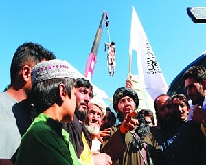 Taliban hang body at square in back-to-old-ways display