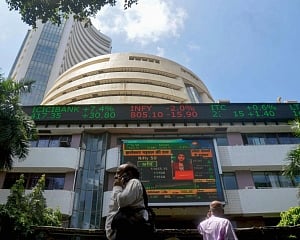 Markets go into tailspin after RBI's rate hike surprise; Sensex, Nifty slump over 2 pc