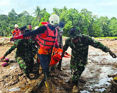 Damaged roads, debris slow relief operations in Asia after deadly floods