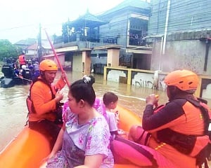 Floods in Indonesia leave at least 11 dead, 13 missing